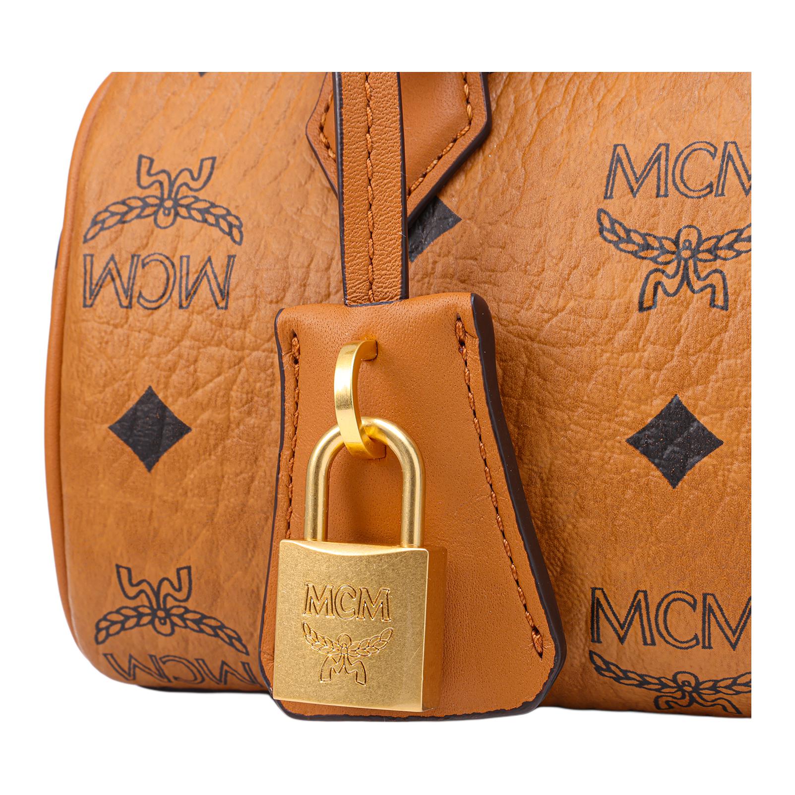 MCM Ella Mini Visetos Monogram Boston Crossbody Bag with Gold-Tone Lock Charm – Cognac Brown